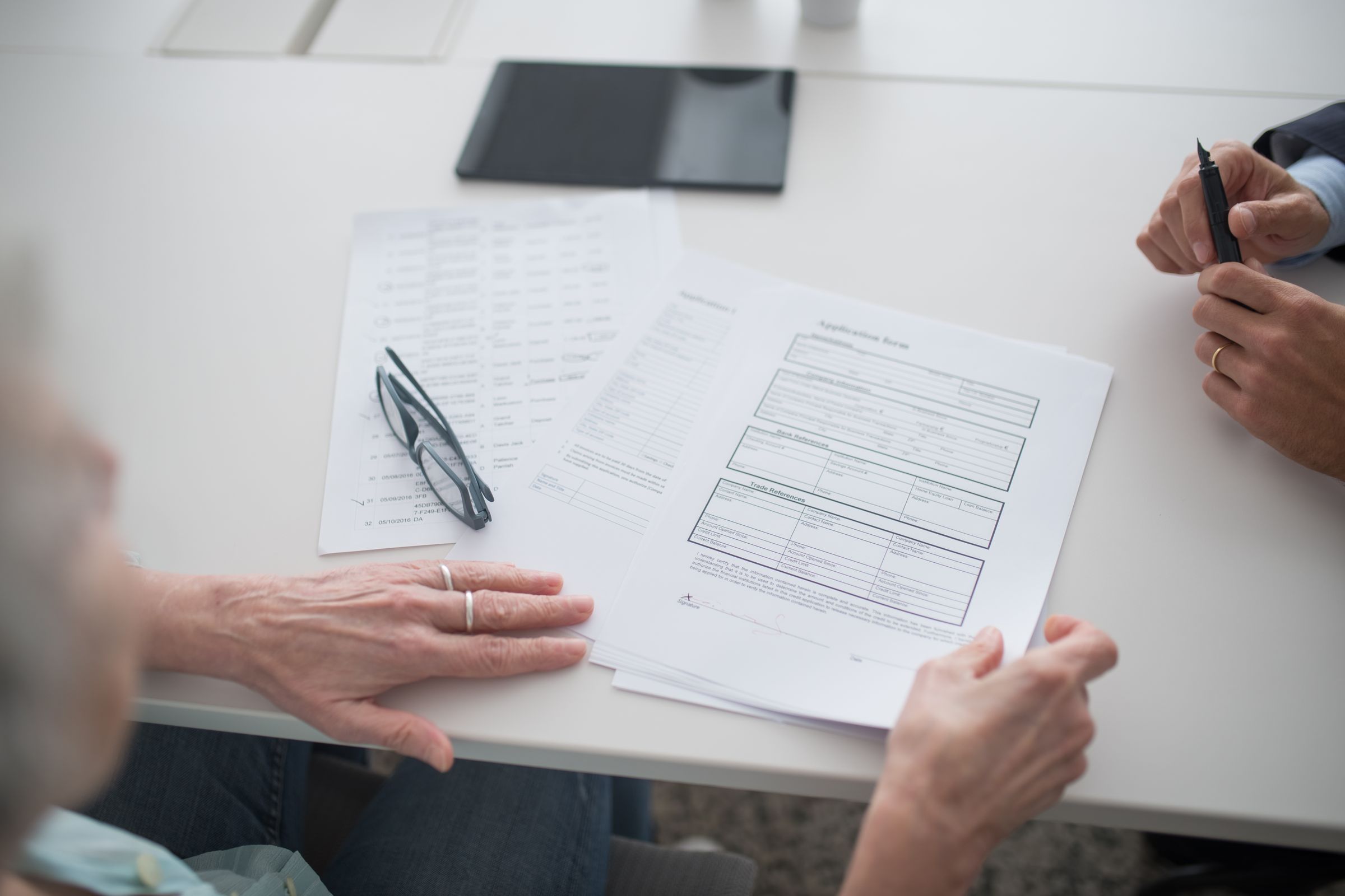 Legal professionals reviewing case documents for an international inheritance search